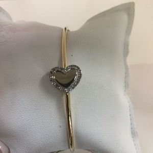 14kt y/g approx .22cts/100 diamonds . Bangle brac